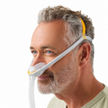 Fisher & Paykel Solo Nasal Pillows Mask Worn by a Man